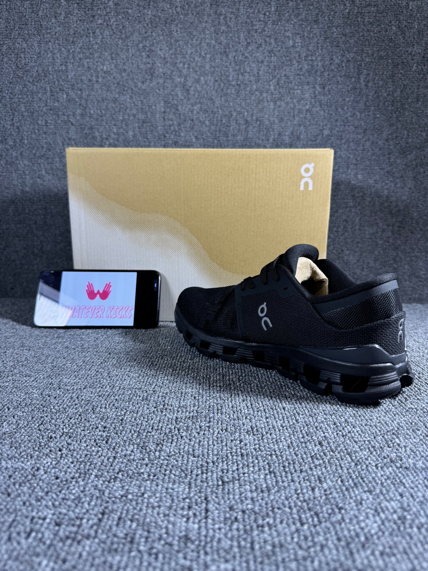 On Cloud X 4 running shoe in the black and eclipse