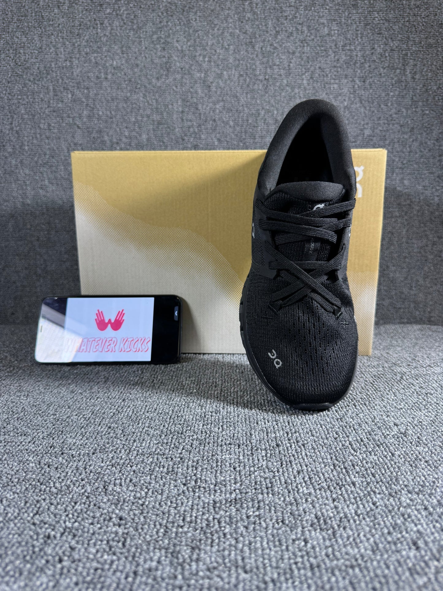 On Cloud X 4 running shoe in the black and eclipse