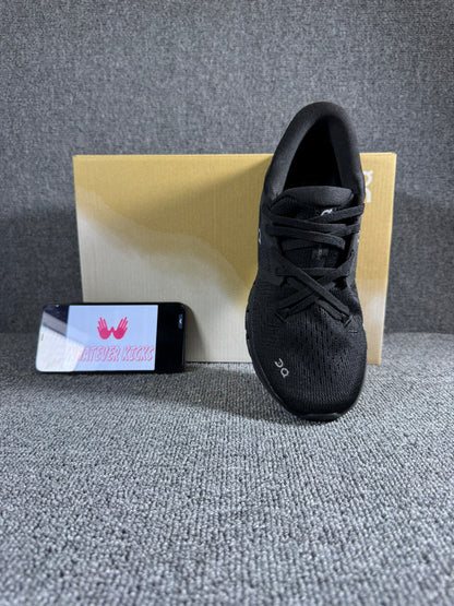 On Cloud X 4 running shoe in the black and eclipse