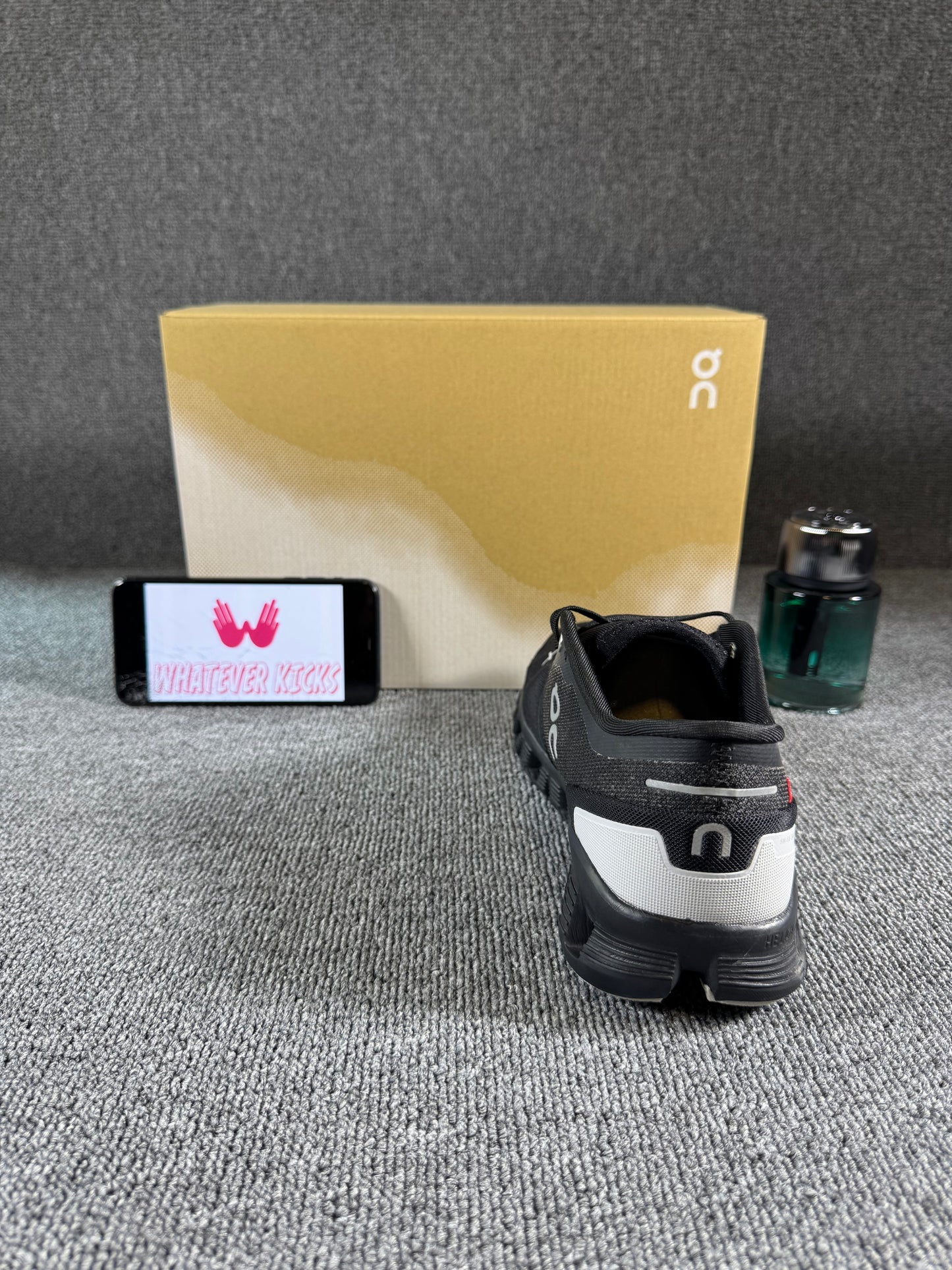 This is a pair of On Cloud X 3 sneakers in black