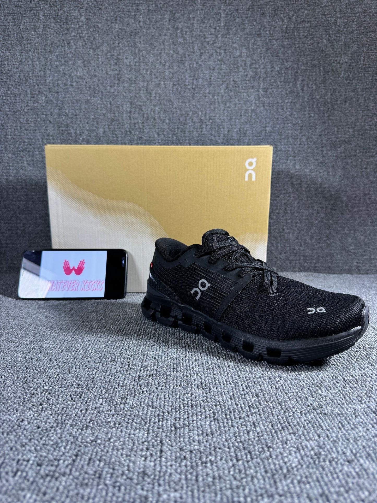 On Cloud X 4 running shoe in the black and eclipse