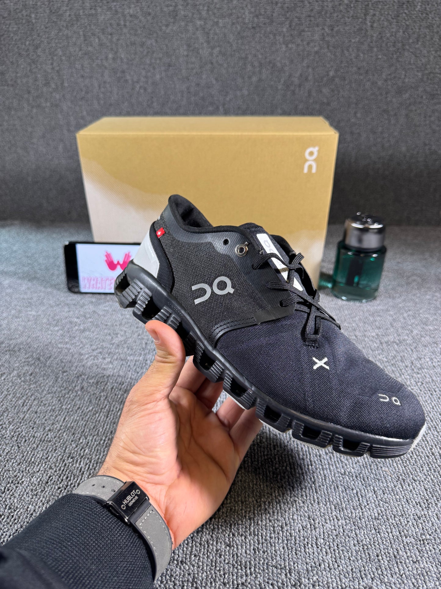 This is a pair of On Cloud X 3 sneakers in black