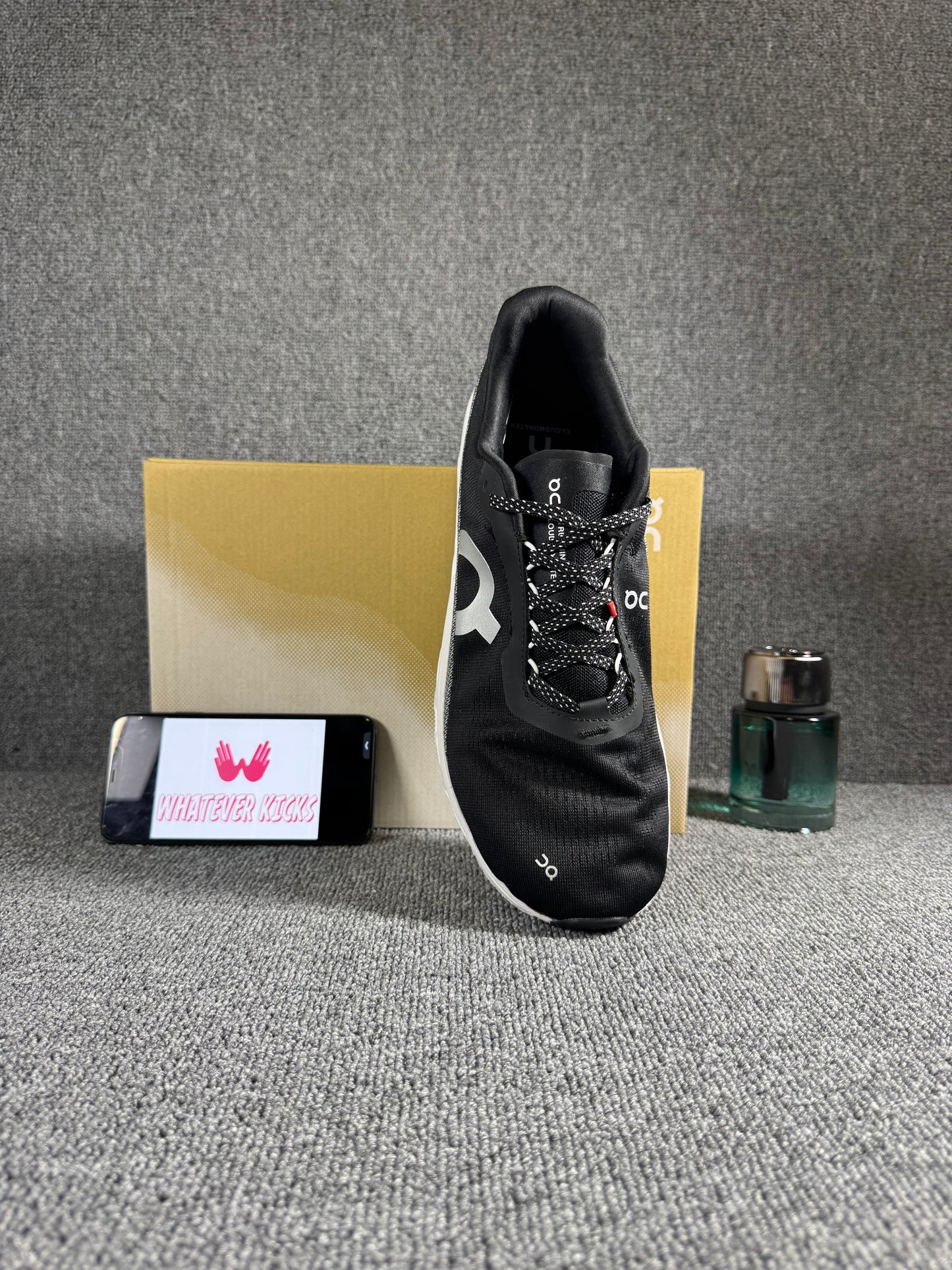 On Cloudmonster 2 running shoes in black and white