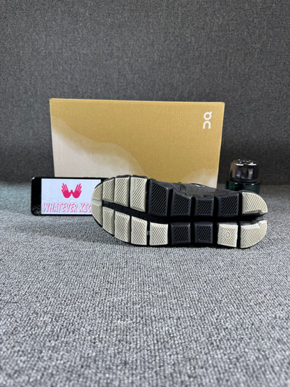 This is a pair of On Cloud X 3 sneakers in black