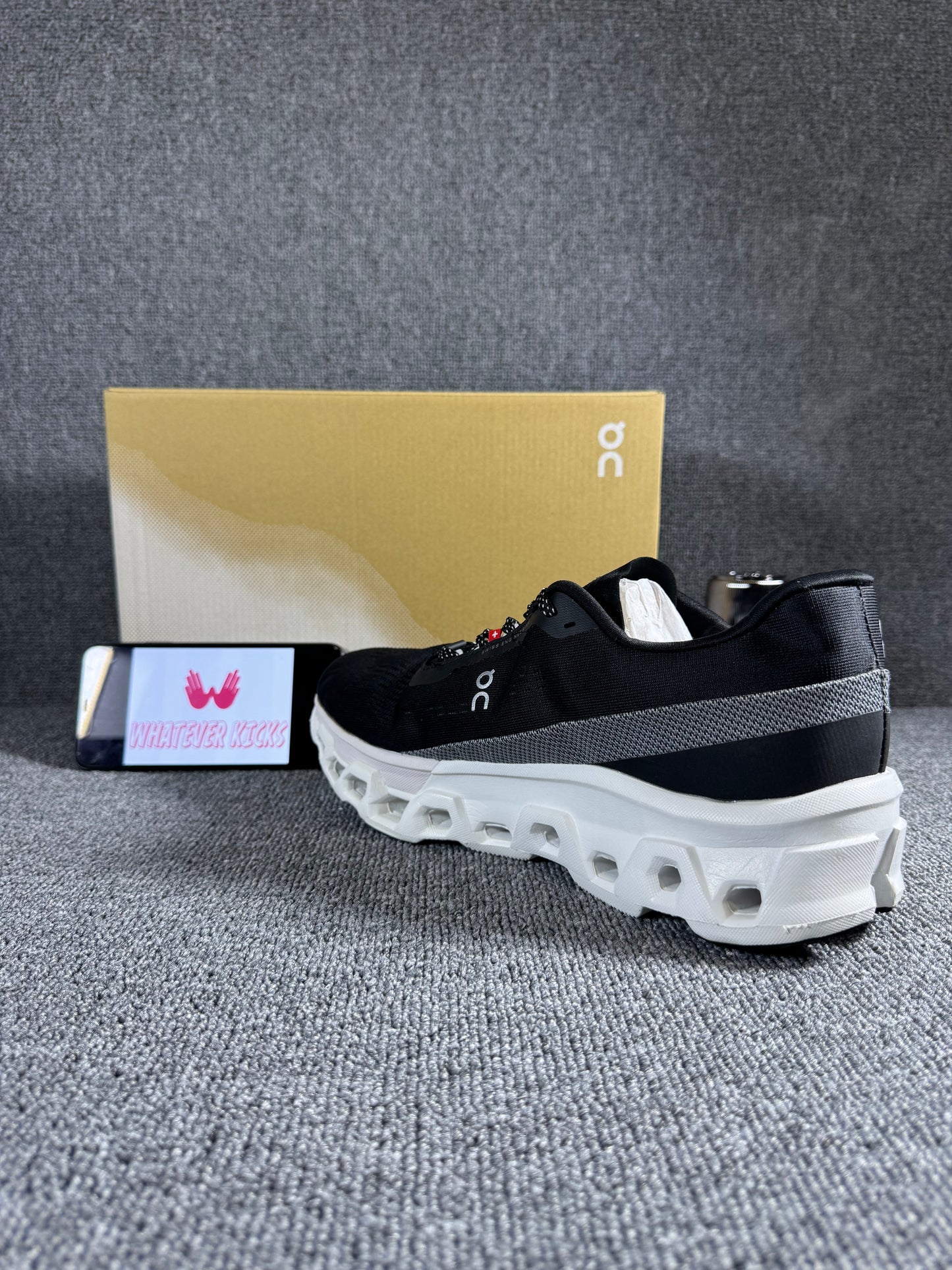 On Cloudmonster 2 running shoes in black and white