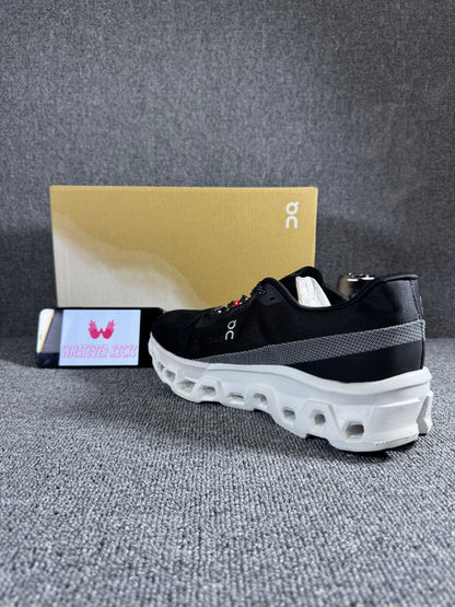 On Cloudmonster 2 running shoes in black and white