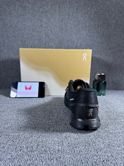 On Cloud X 4 running shoe in the black and eclipse