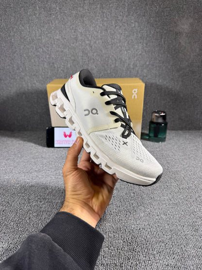 On Cloud X 4 running and training shoes in an ivory/black