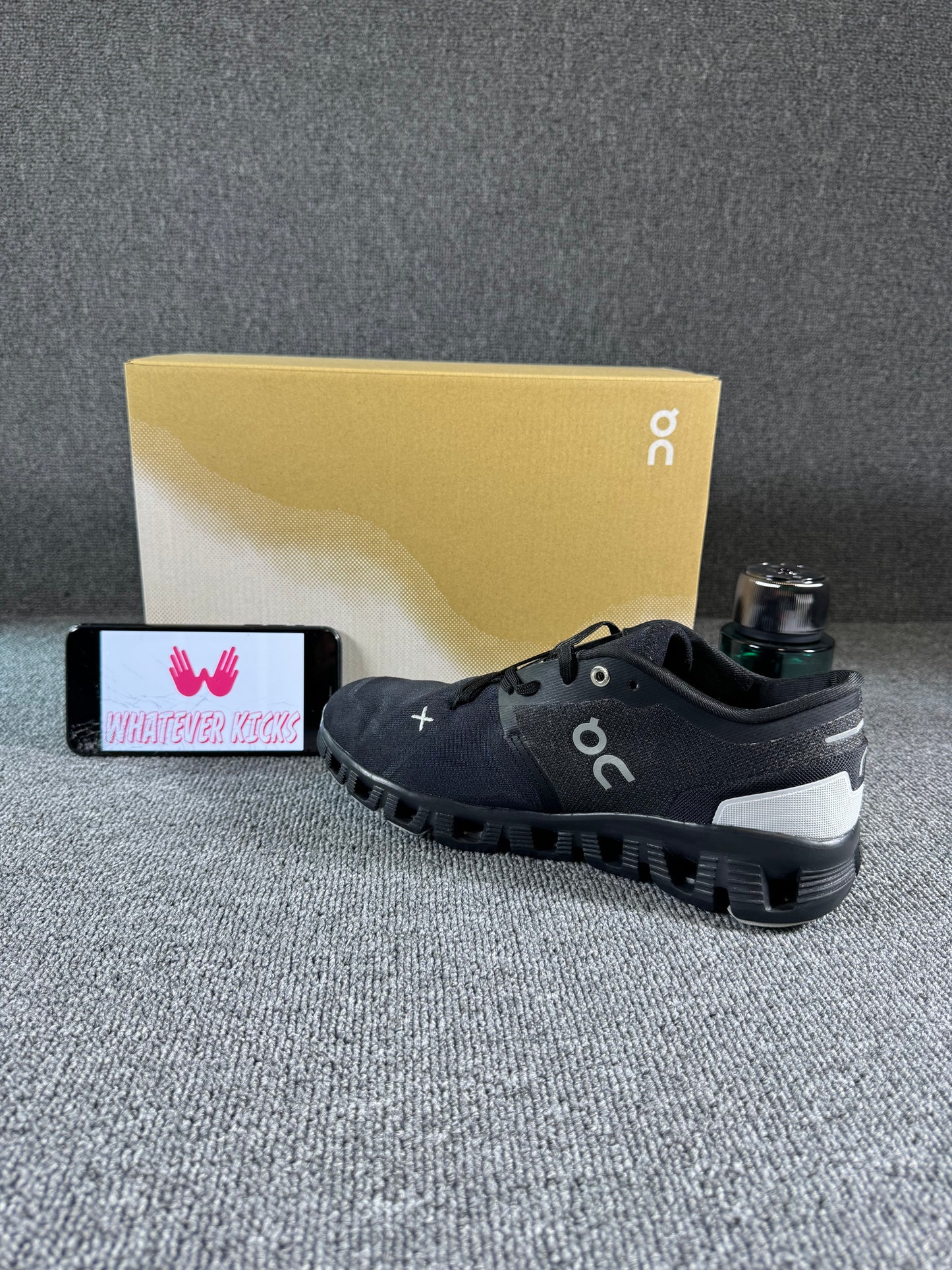 This is a pair of On Cloud X 3 sneakers in black