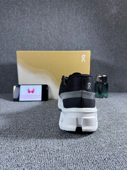 On Cloudmonster 2 running shoes in black and white