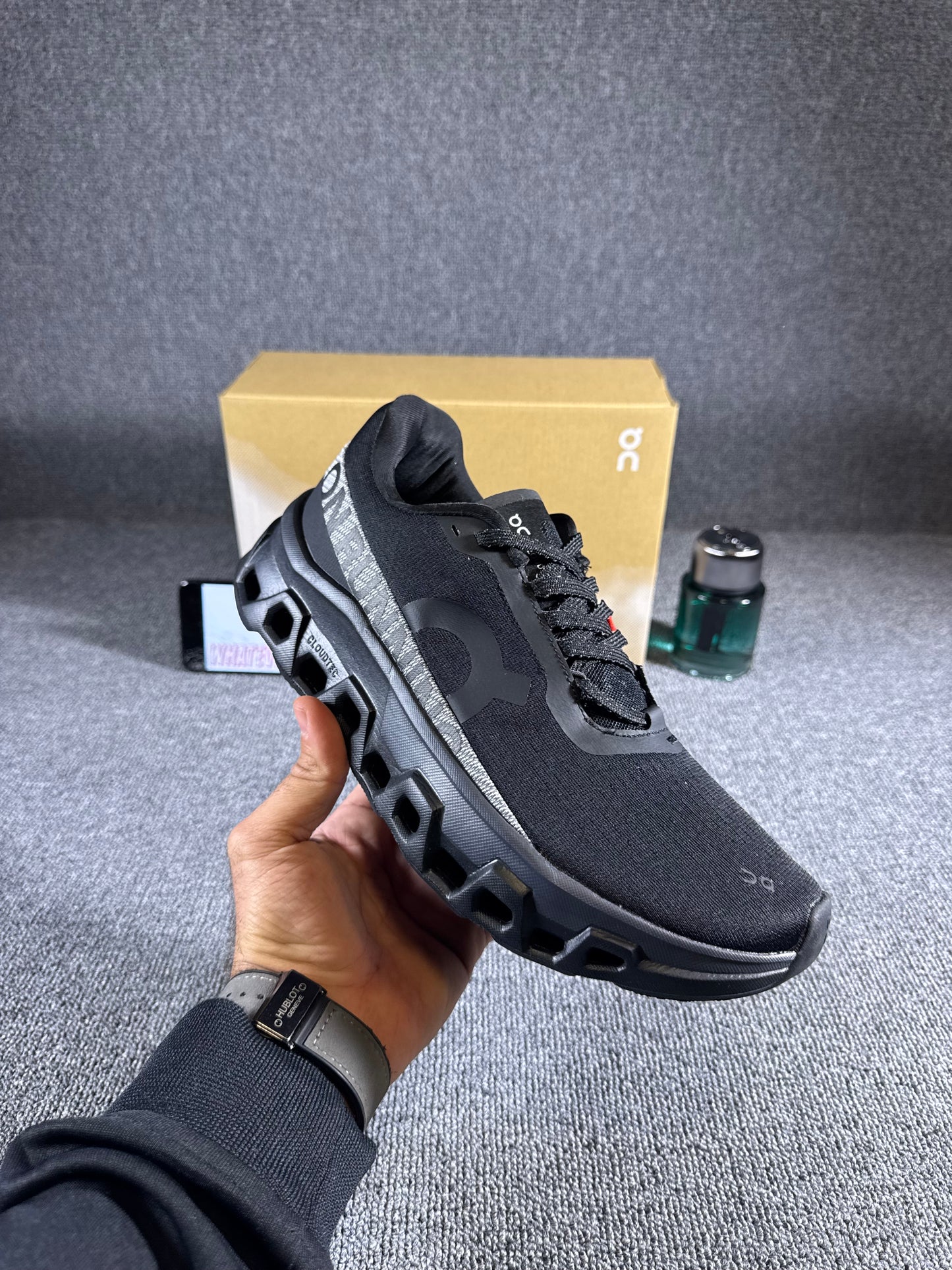 On Cloudmonster 2 running Black shoes