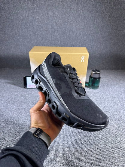 On Cloudmonster 2 running Black shoes