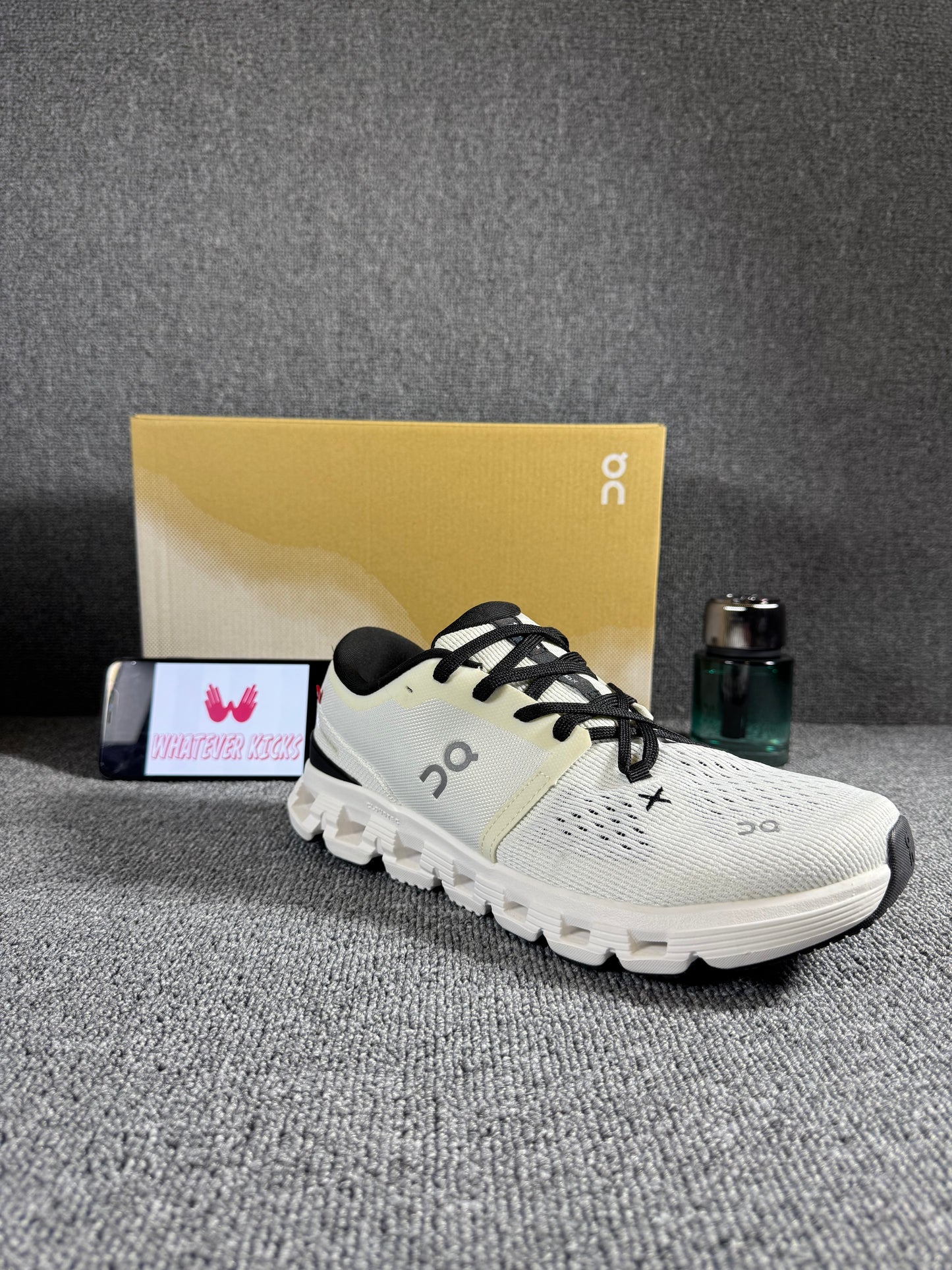 On Cloud X 4 running and training shoes in an ivory/black